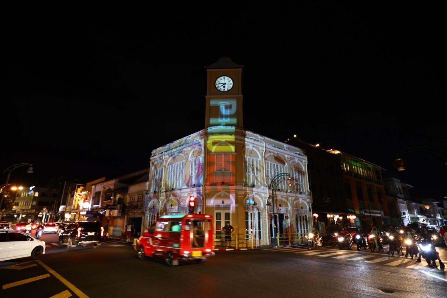 The clock tower in Phuket's old town is illuminated during the reopening of the island under the sandbox scheme.