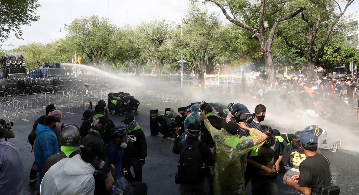 Police spray water at protesters belonging to the Free Youth group during a clash near the Phan Fa intersection on Ratchadamnoen Avenue yesterday. The water cannon was used to deter the protesters as they tried to remove barbed wire during their march to Government House. Arnun Chonmahatrakool Police spray water at protesters belonging to the Free Youth group during a clash near the Phan Fa intersection on Ratchadamnoen Avenue yesterday. The water cannon was used to deter the protesters as they tried to remove barbed wire during their march to Government House. Arnun Chonmahatrakool