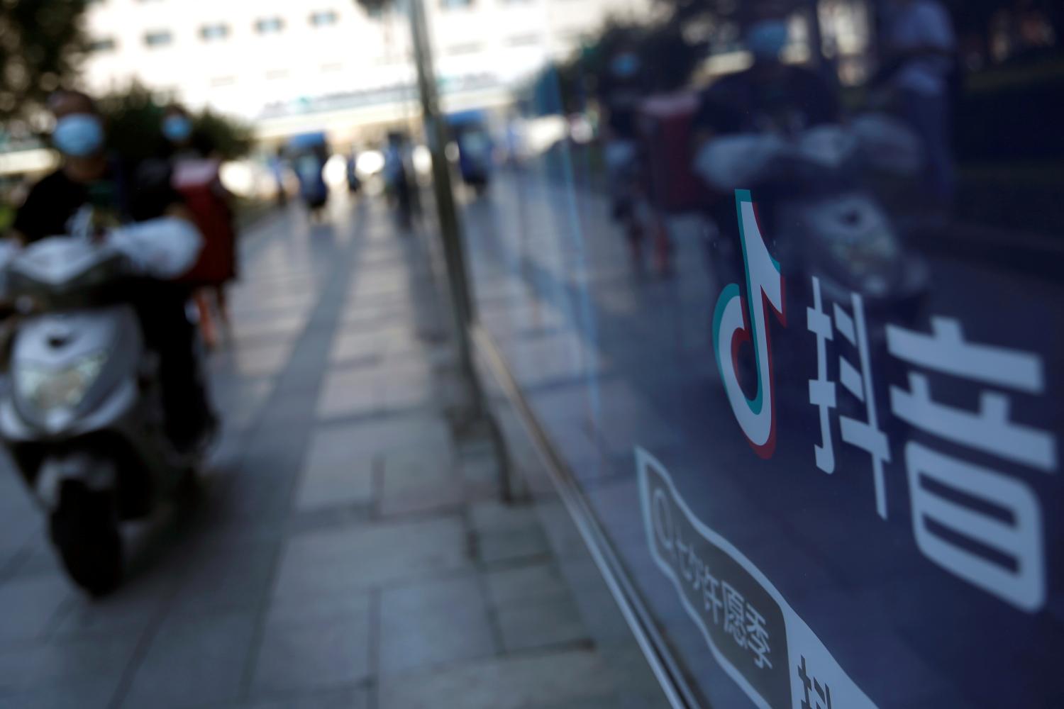 The Douyin logo is seen on an advertisement at a bus stop in Beijing. REUTERS