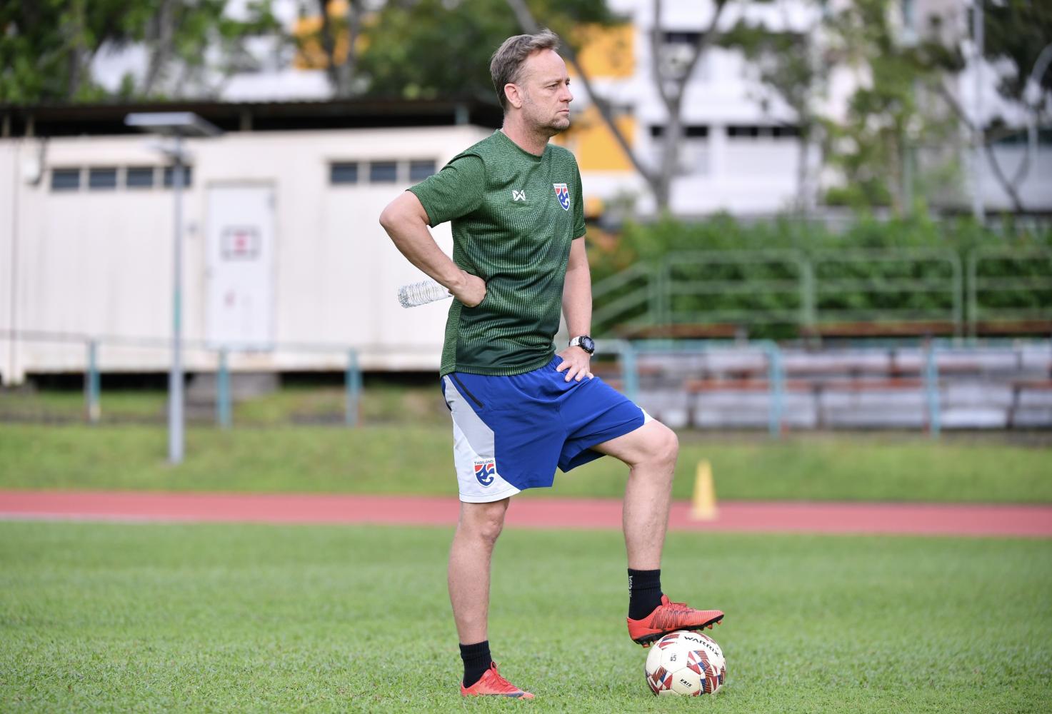 Thailand coach Mano Polking watches his players train.