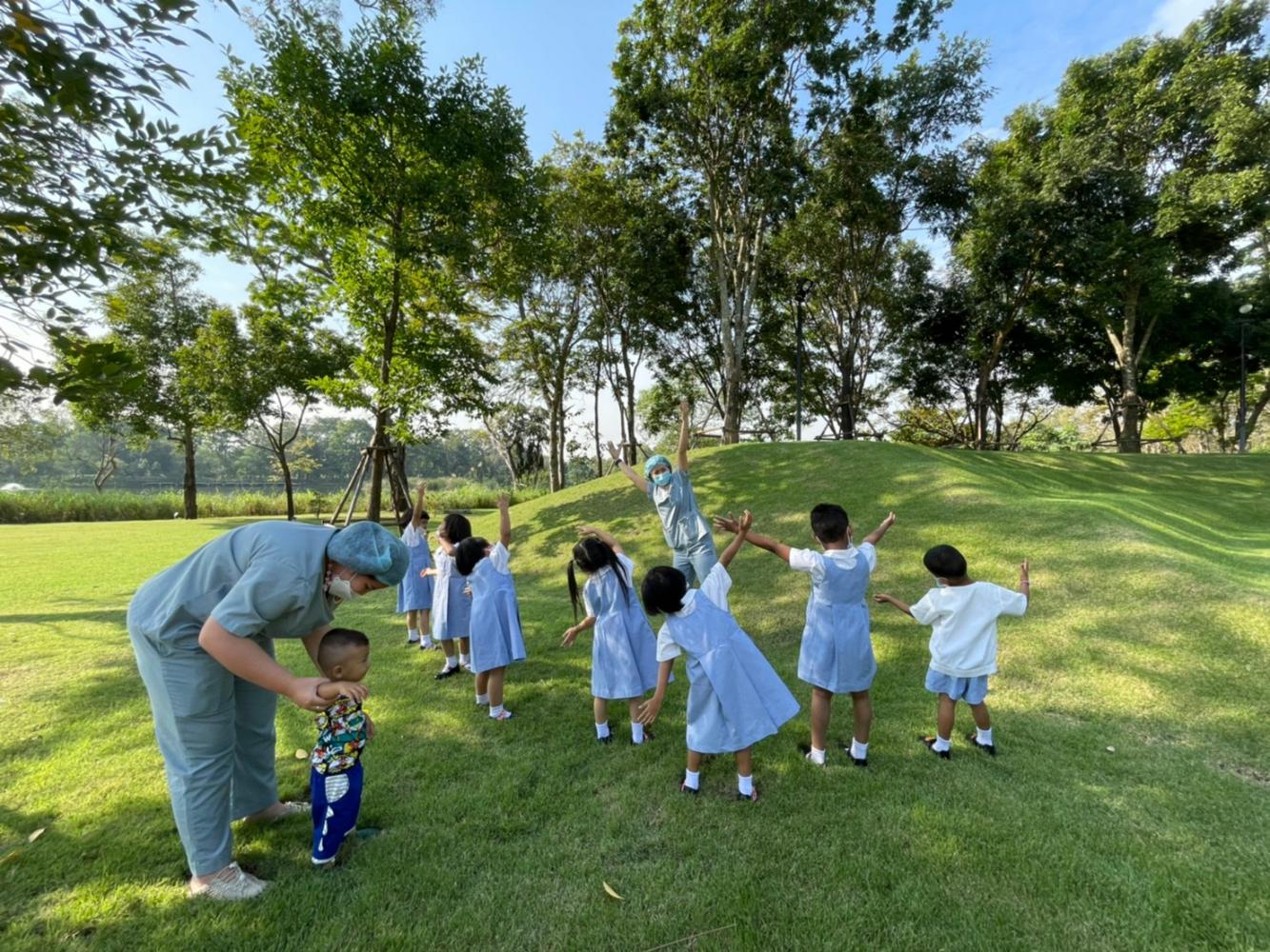 Students learn lessons outside a classroom following the implementation of the nature-based approach at the National Institute for Child and Family Development. (Photo: Mahidol University)