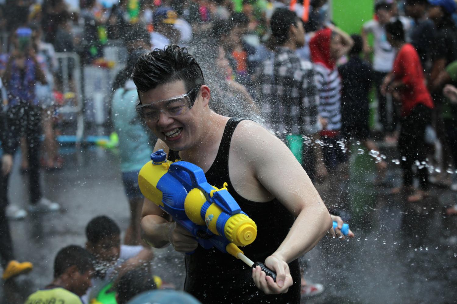 Songkran revellers enjoy splashing each other at a celebration at CentralWorld in April 2017, before the Covid restrictions. (Photo: Seksan Rojjanametakul)