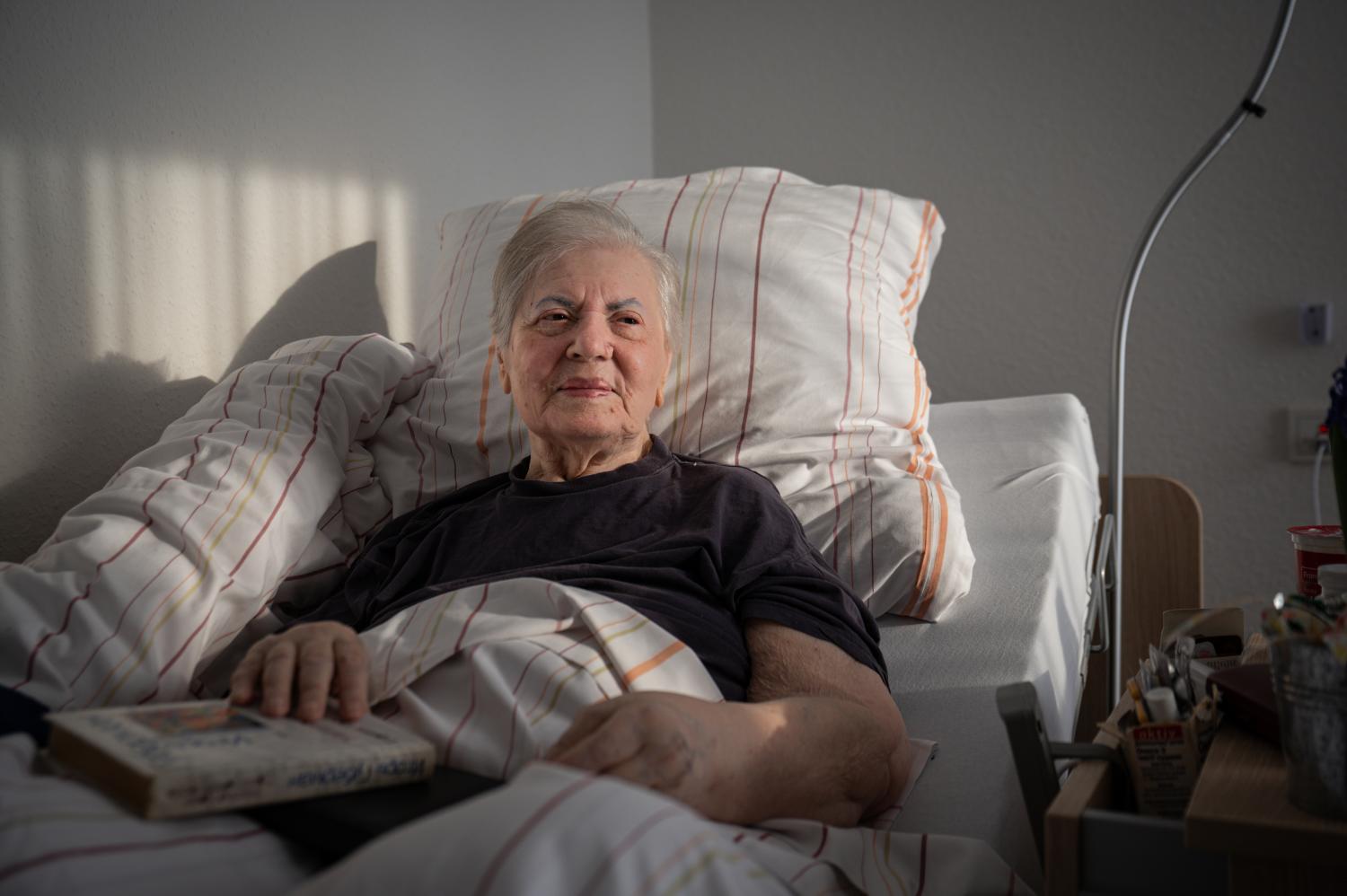 Galina Ploschenko, a Holocaust survivor from Ukraine, in her room at the AWO senior care centre in Hanover, Germany. photos:  LENA MUCHA/nyt