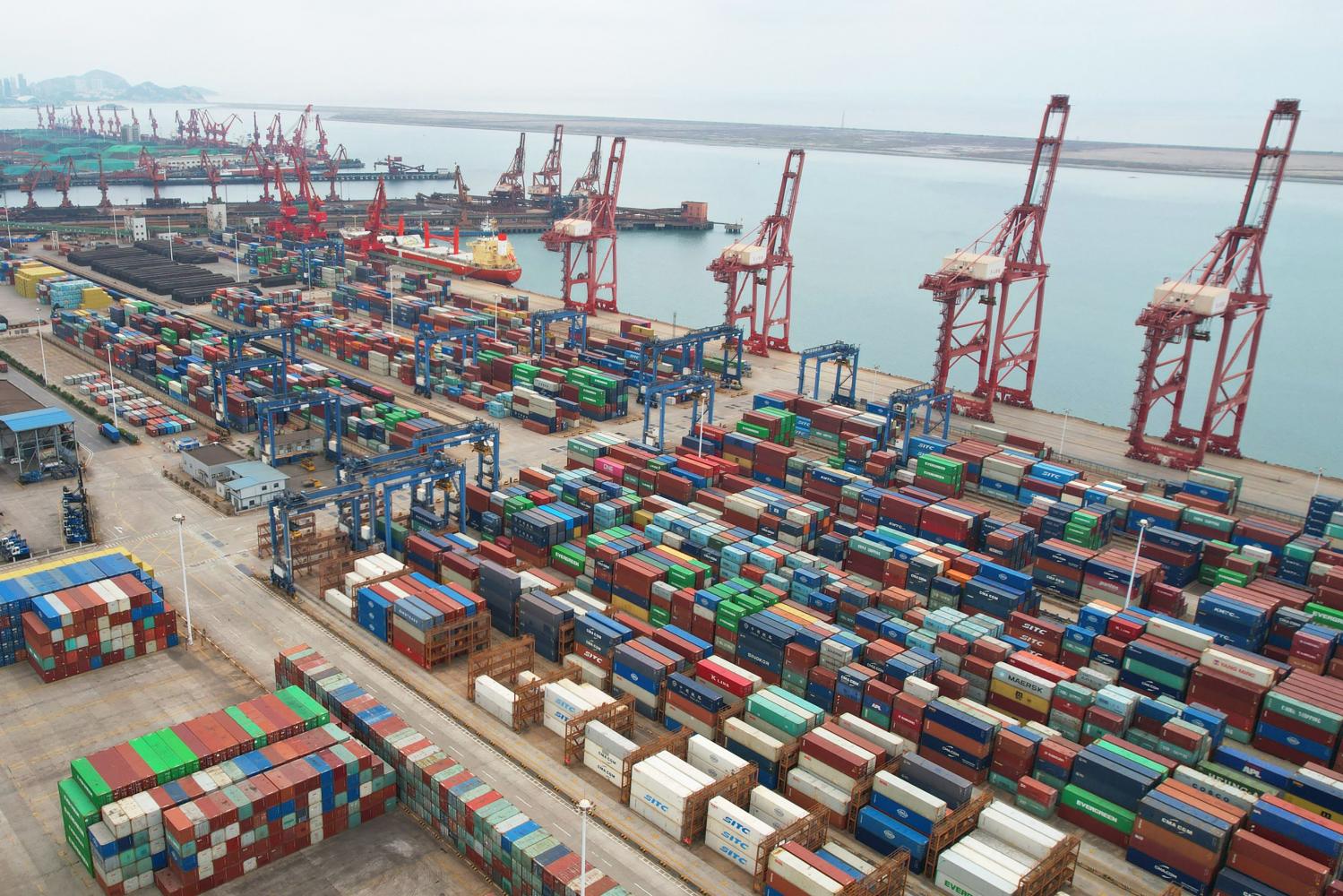 An aerial photo shows cargo containers stacked at a port in Lianyungang in China's eastern Jiangsu province on May 9, 2022.  AFP