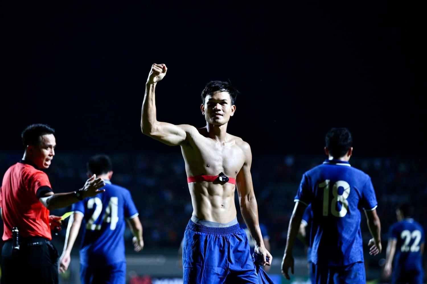 Thailand striker Adisak Kraisorn celebrates after scoring against Turkmenistan.