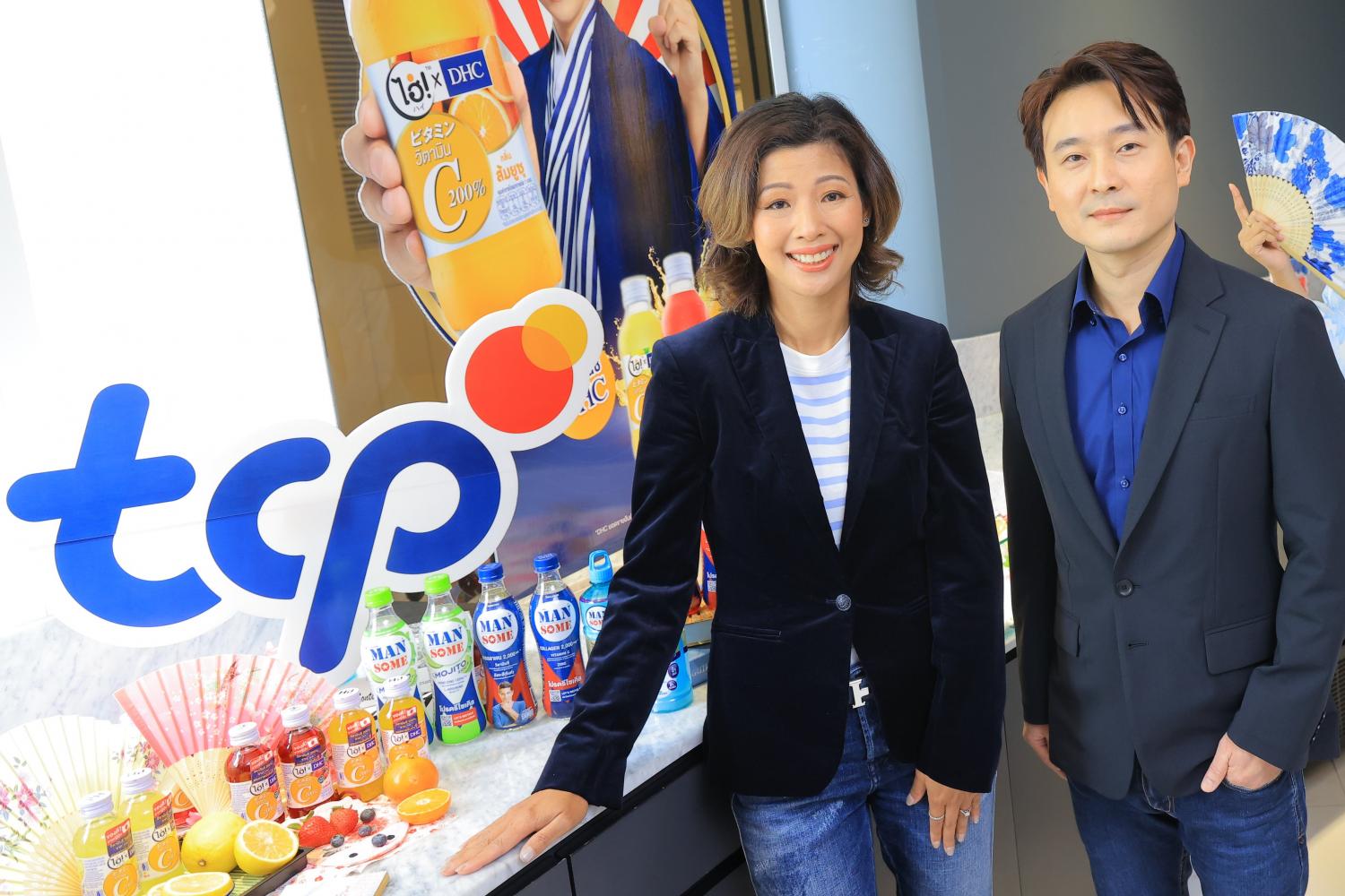 Mrs Prapaipak and Mr Anurak promote the firm's beverages at a press conference.