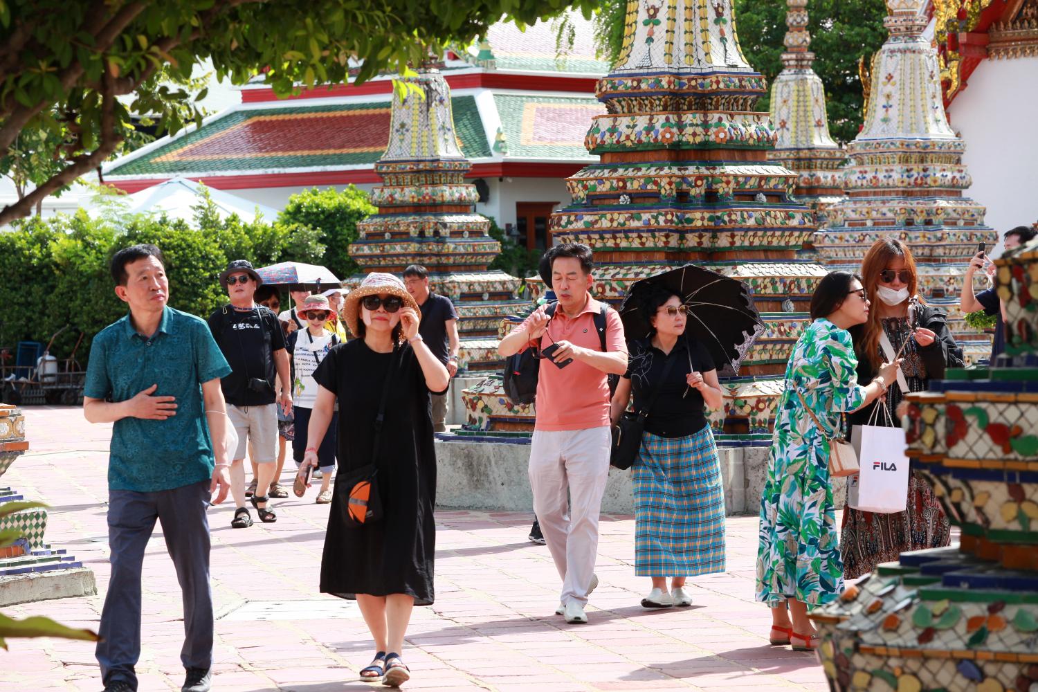 Locals and foreign tourists visit Wat Phra Chetuphon or Wat Pho in Bangkok. (Photo: Apichart Jinakul)