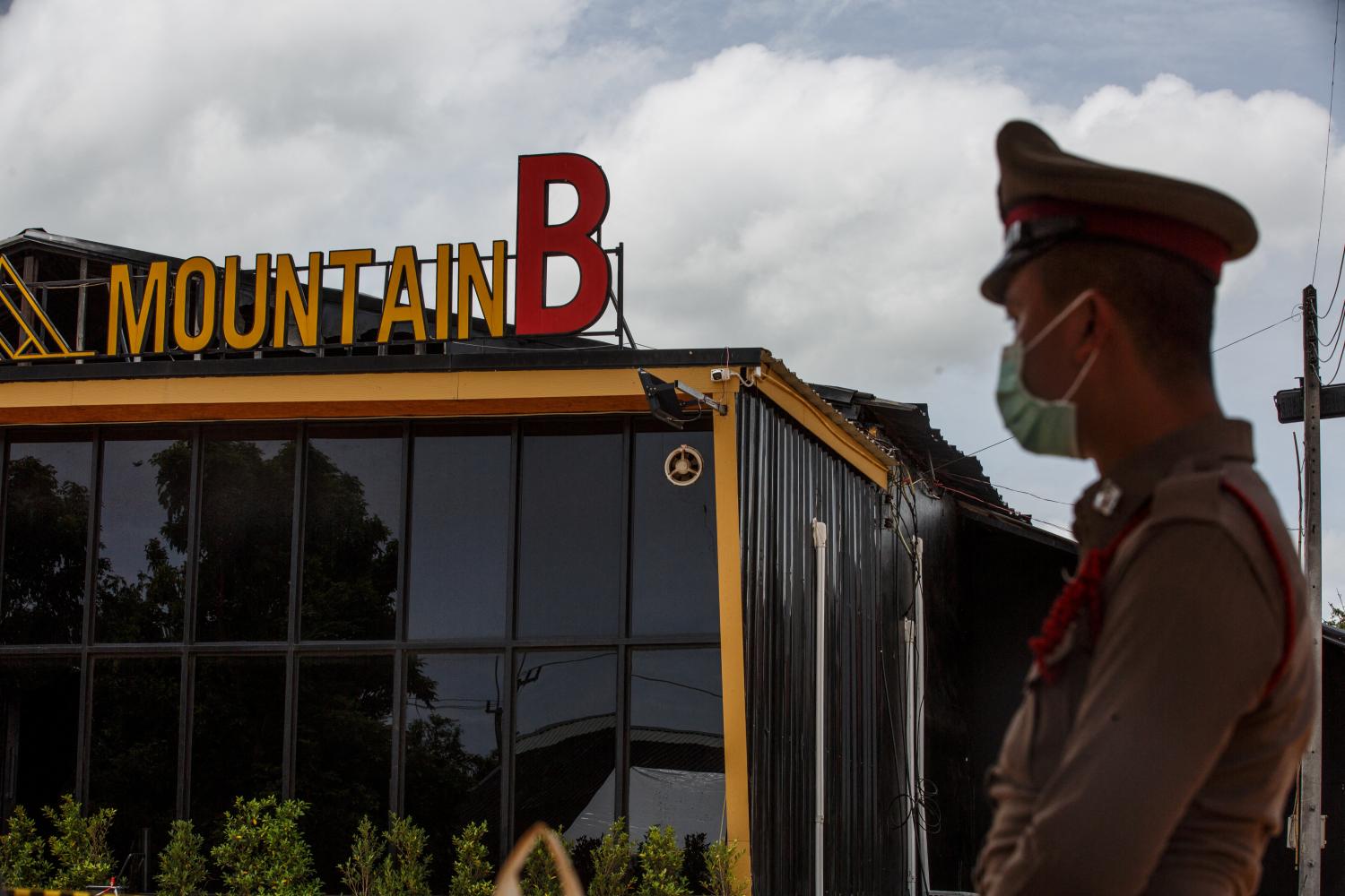 A police officer stands outside the Mountain B nightclub following the deadly blaze on Aug 5. REUTERS