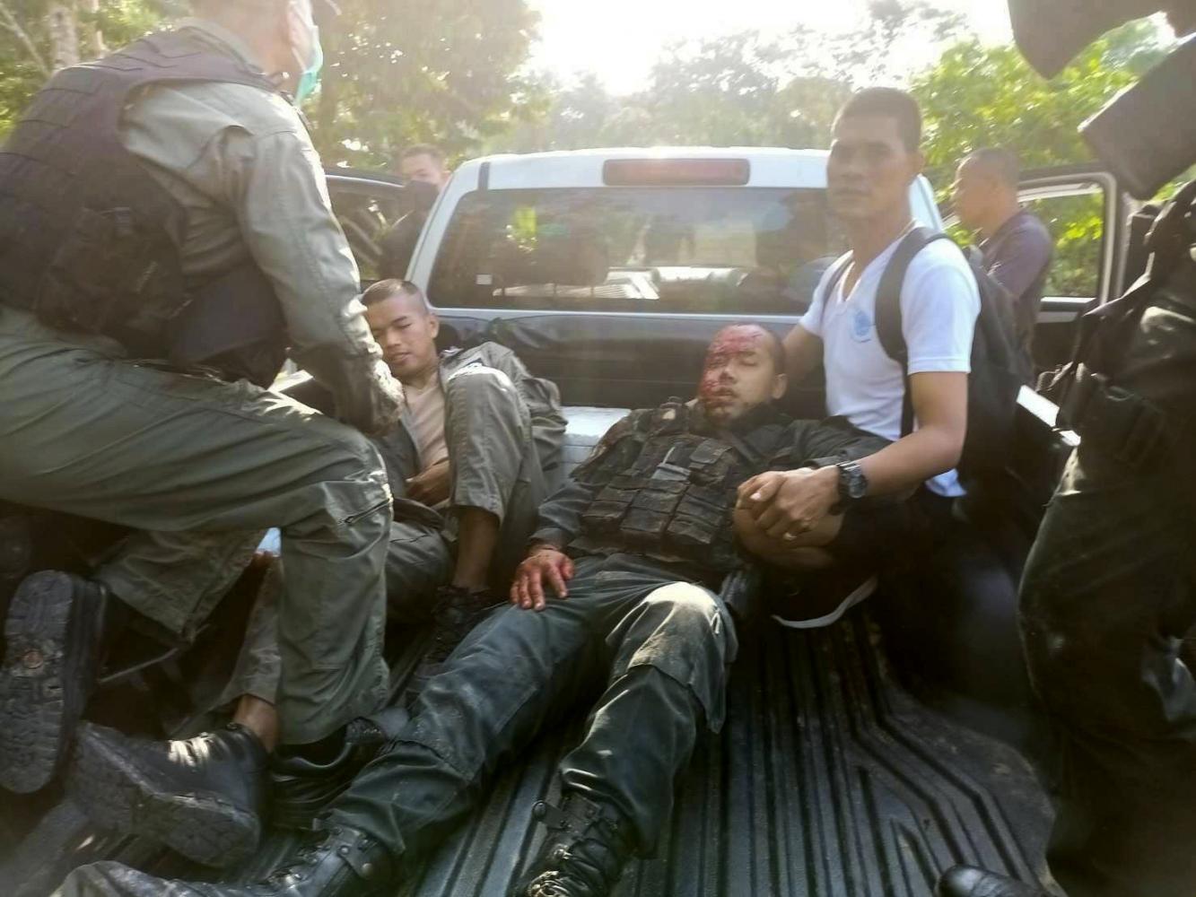 Injured policemen are taken to hospital after a bomb exploded while they were attending the scene of an earlier blast in Narathiwat. Abdullah Benjakat