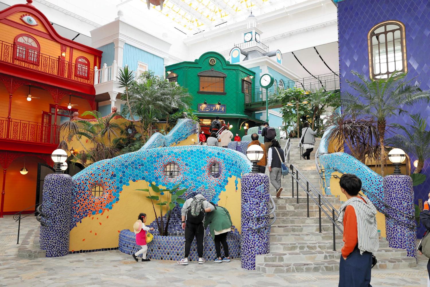 Visitors look around the central staircase of 'Ghibli's Great Warehouse' on the opening day of the new Ghibli Park in Nagakute, Aichi Prefecture on Tuesday. (AFP photo)