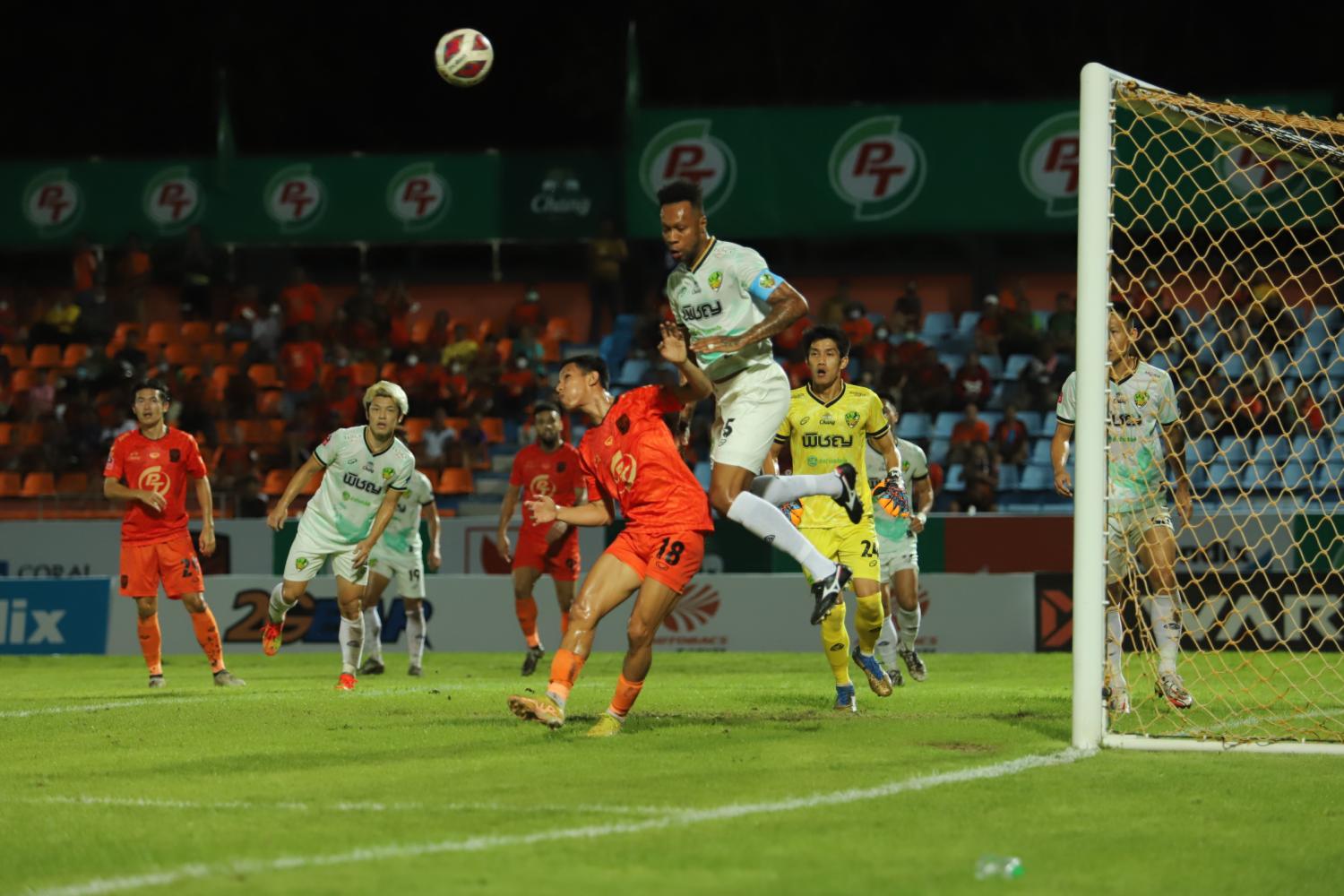 Lampang's Brinner jumps for a header in front of Prachuap's Apichart Denman on Sunday night.