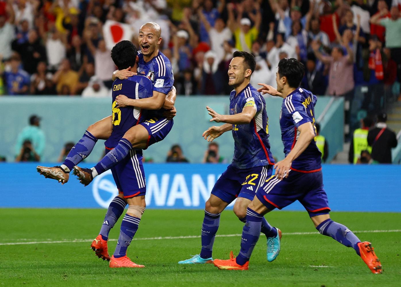 Japan's Daizen Maeda (second left) celebrates with teammates after scoring against Croatia. (Reuters photo)