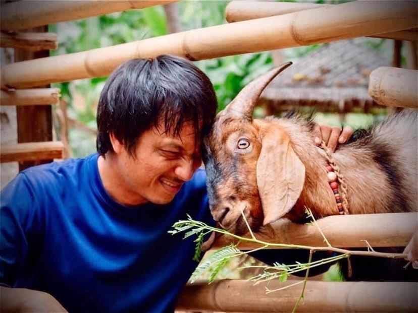 Pong with the farm's late goat Tanjiro. (Photo courtesy of Conrad Koh Samui)