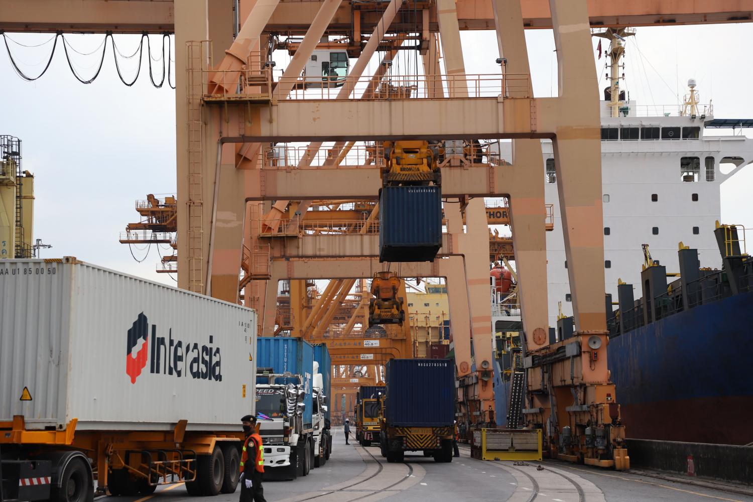 Shipping containers are sorted at Klong Toey port in Bangkok. (Photo: Varuth Hirunyatheb)