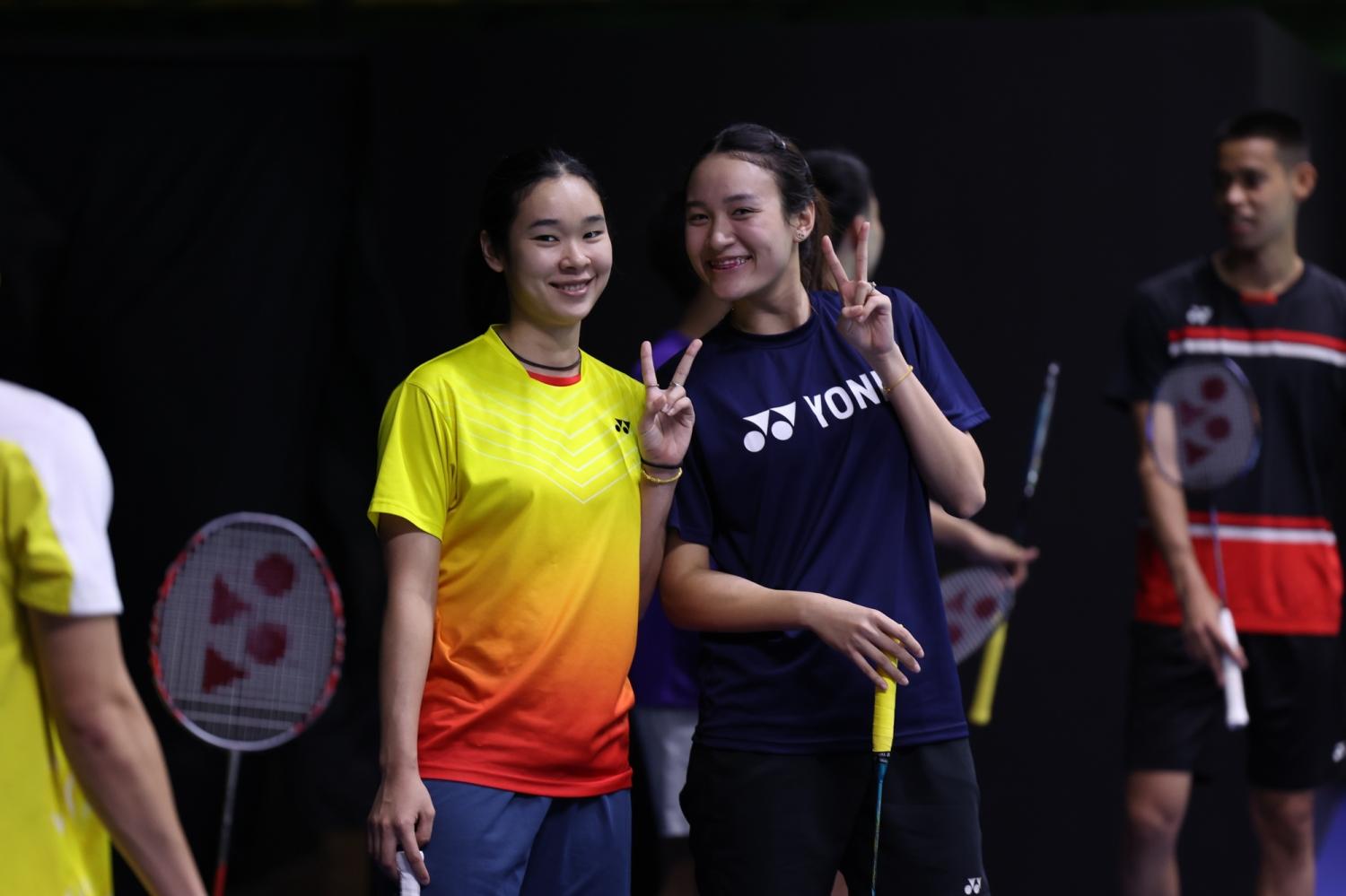 Sisters Benyapa, left, and Nuntakarn Aimsaard pose during practice yesterday.