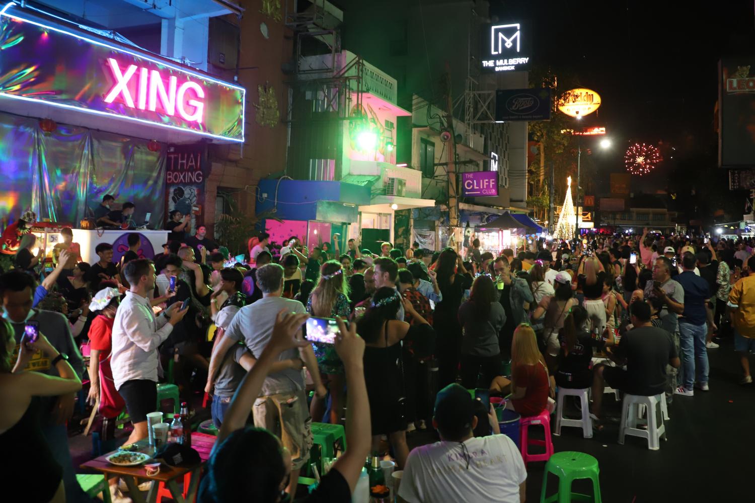 Khao San Road springs to life at night with music and crowds of tourists.  Nutthawat Wicheanbut