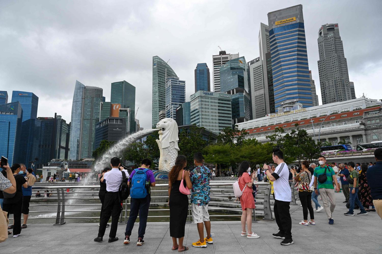 People gather at the Merlion Park along Marina Bay in Singapore last month. AFP