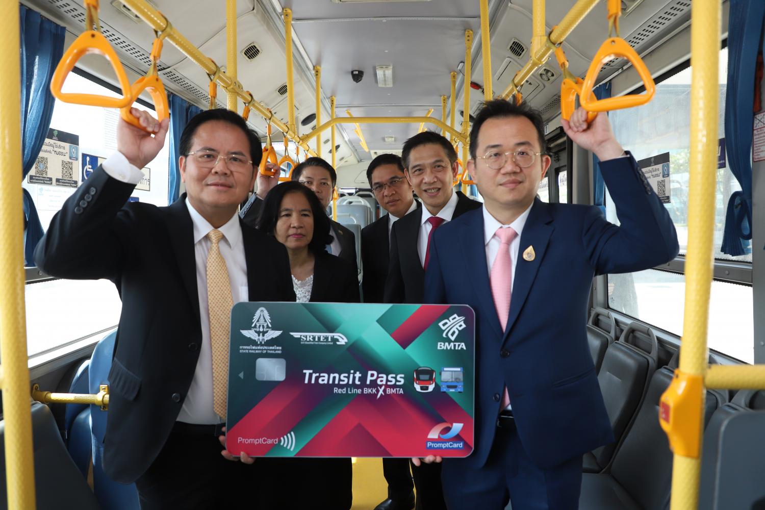 Pichet Kunadhamraks, director-general of the Department of Rail Transport, right, rides a Bangkok bus before attending the launch of the Transit Pass Red Line BKK X BMTA. Varuth Hirunyatheb