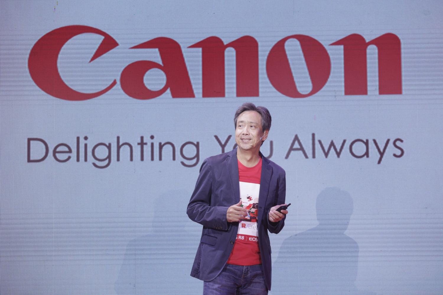 Mr Yokota at the launch of Canon's two new camera models. He remains optimistic about demand for professional cameras from content creators.