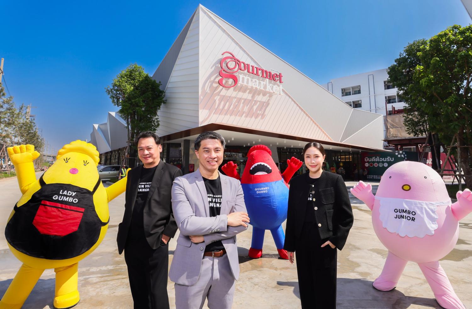 Mr Supawut, centre, Ploychompu Umphuj, The Mall Group's vice-president for merchandising at Gourmet Market, right, and Chutidej Poocharoentou, The Mall Group's vice-president for merchandising of food, attend the official opening of Gourmet Market at Design Village Bangna.