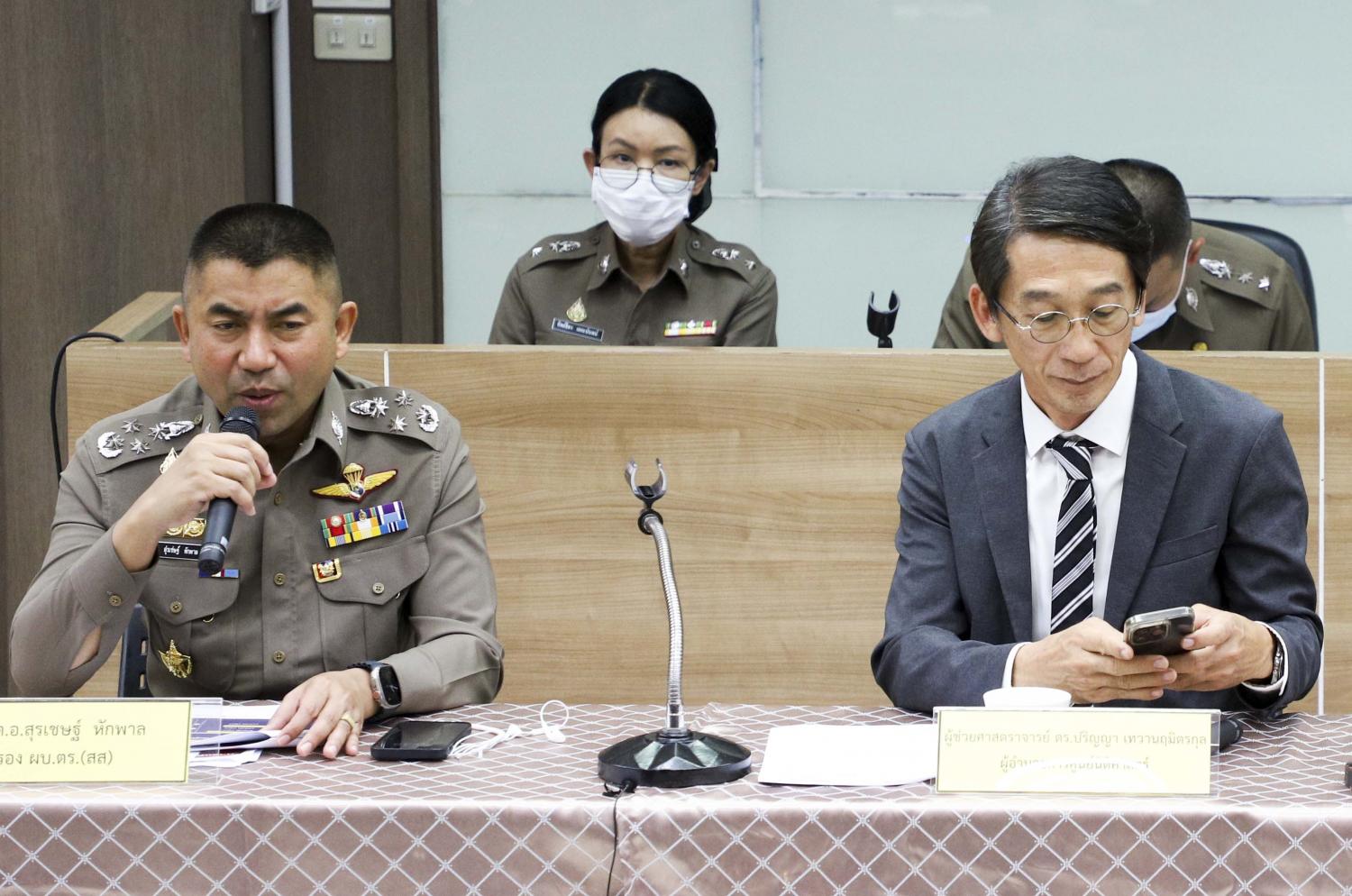 Pol Gen Surachate Hakparn, left, announces police will remove about 10 million innocent people from their database. (Photo: Pattarapong Chatpattarasill)