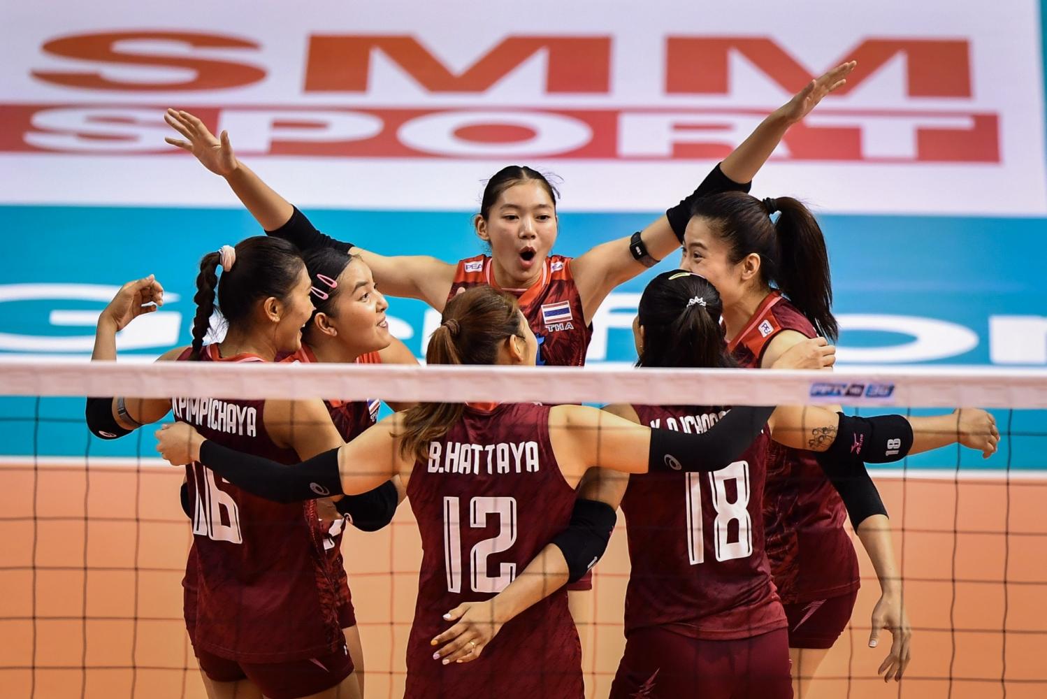 Thailand's Chatchu-On Moksri, centre, and teammates celebrate during the final against China at the Asian Women's Volleyball Championship last week. (Photo supplied)