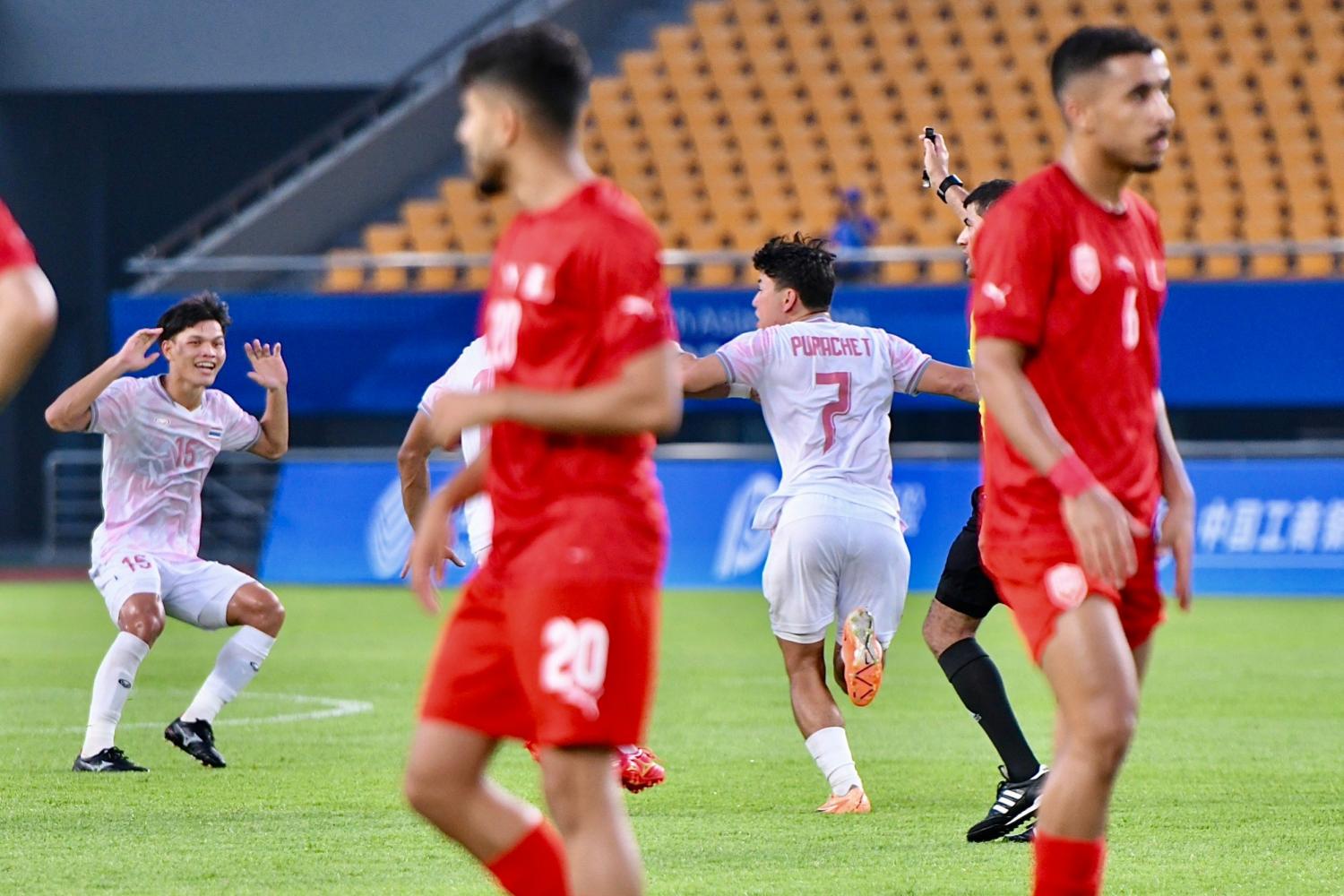 Thailand's Purachet Thodsanid, No.7, celebrates his equaliser against Bahrain at the Asian Games in China on Tuesday. (Photo supplied)