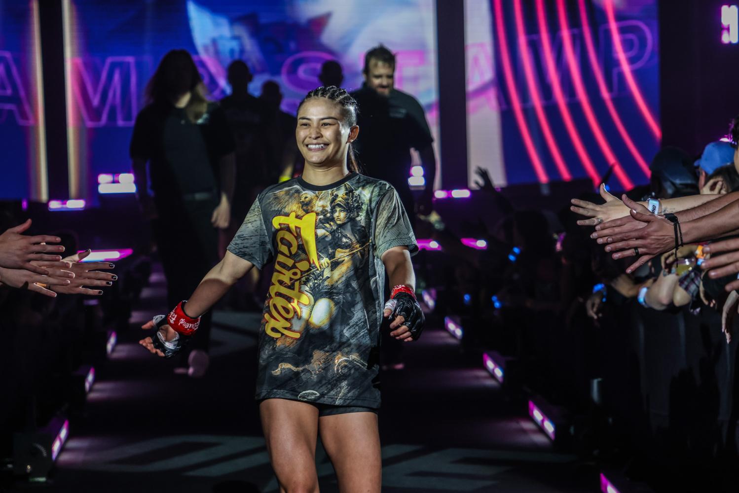 Thai fighter Stamp Fairtex is greeted by her fans before a recent bout.