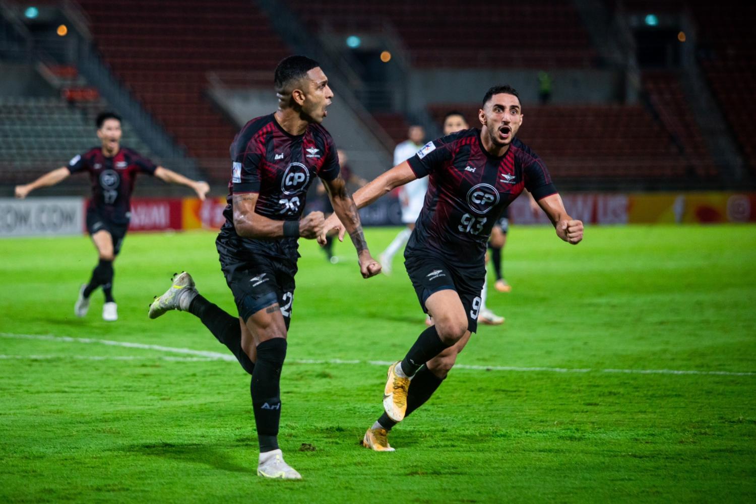 Bangkok United's Willen Mota, left, celebrates with Mahmoud Eid after scoring against Jeonbuk Hyundai Motors in the AFC Champions League.