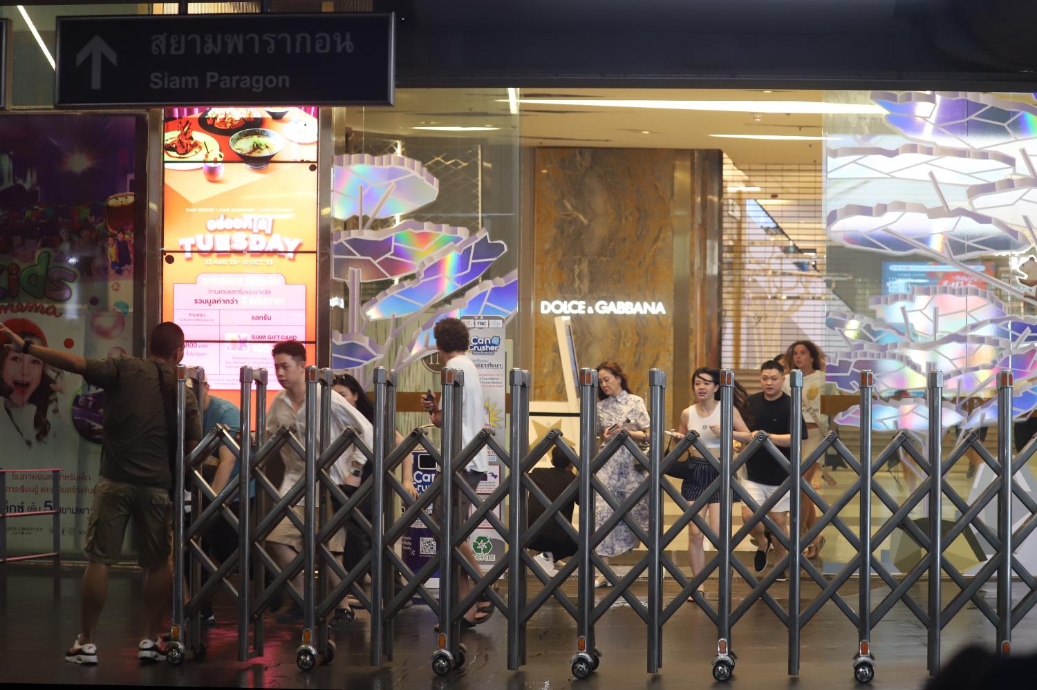 A file photo shows shoppers racing from the Siam Paragon shopping complex to escape the shooting there on Oct 3, which killed two women, a Chinese tourist and a Myanmar worker, and injured five others. Nutthawat Wichieanbut