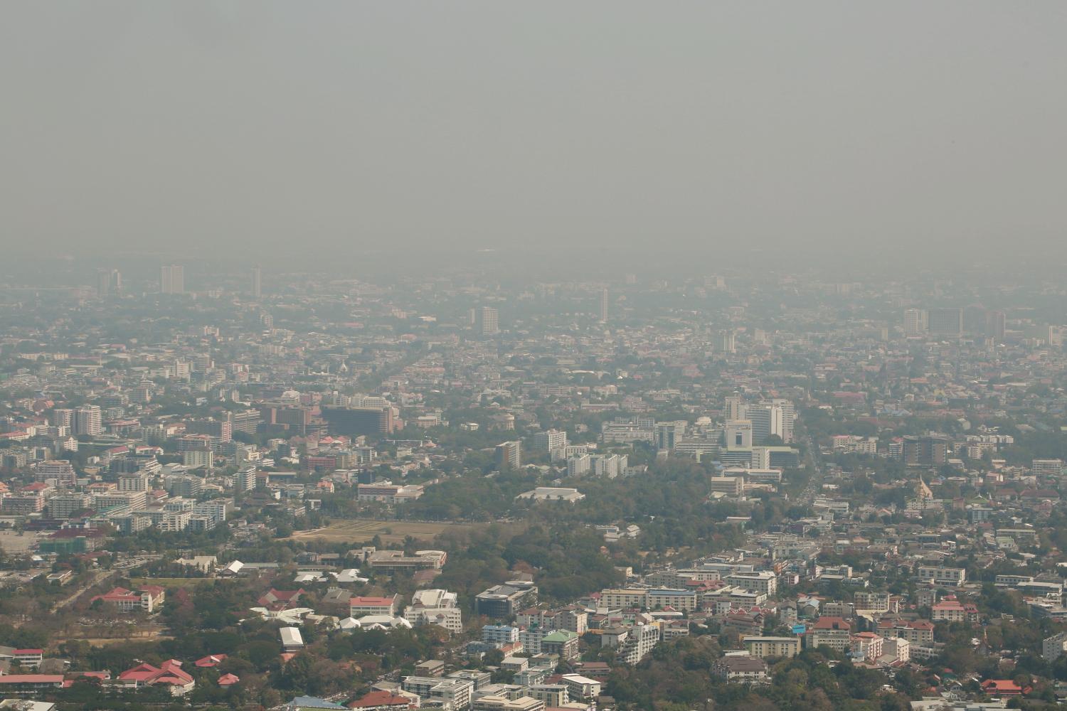 A file photo shows an aerial view from Chiang Mai's Doi Suthep as the city is completely obscured by haze.