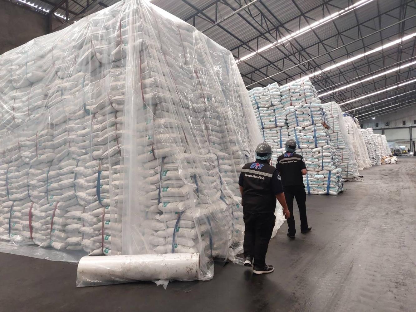 Officers from the Internal Trade Department inspect a sugar factory.