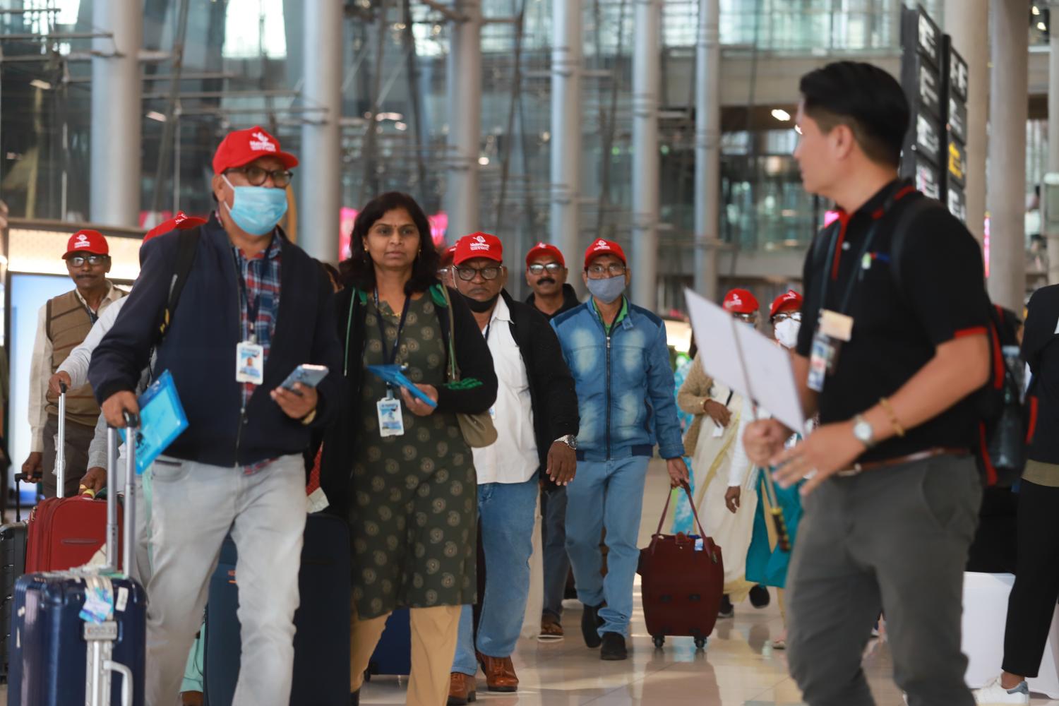 Tourists arrive in groups at Suvarnabhumi airport outside Bangkok.