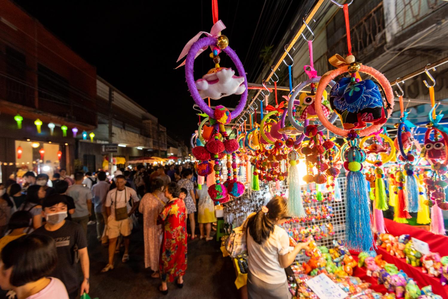 Tourists take in the shopping opportunities available at Wua Lai Walking Street night market in Chiang Mai.