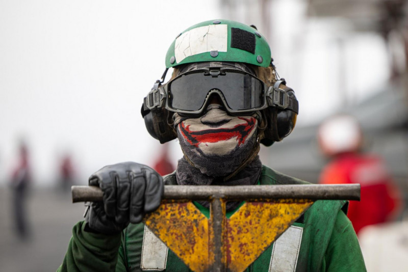 A photo dated March 19 shows a flight deck crew member aboard the USS 'Dwight D Eisenhower' aircraft carrier during operations in the southern Red Sea. Bloomberg