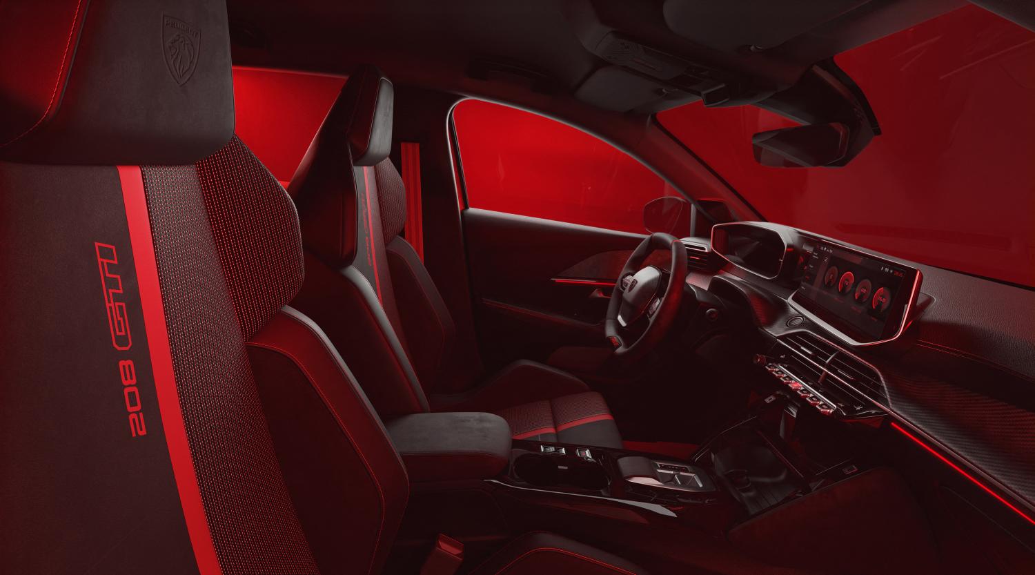 References to the 205 continue inside the e-208 GTi: the bucket seats are split between red and black panels and the floor mats are trimmed in red.