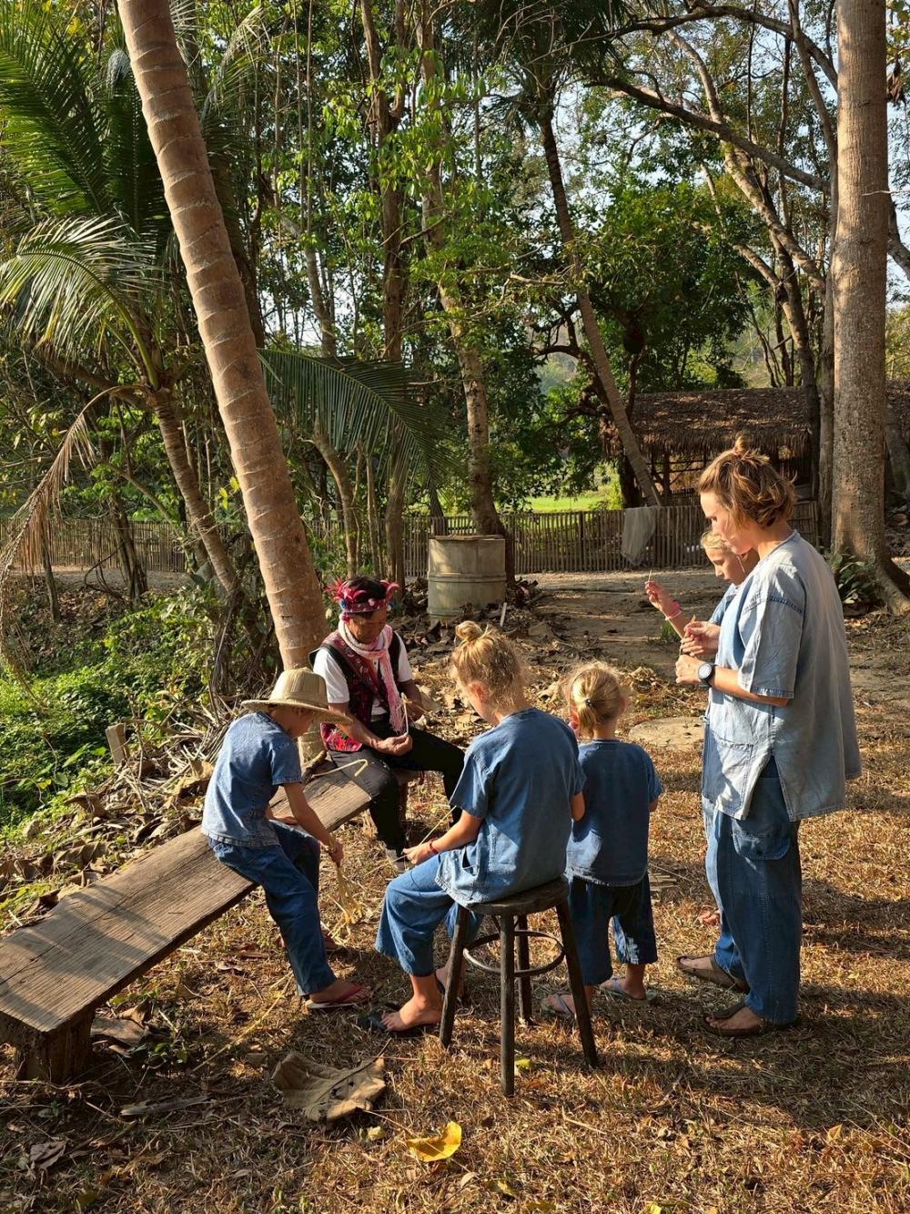 Tourists learn about handicrafts from local artisans.