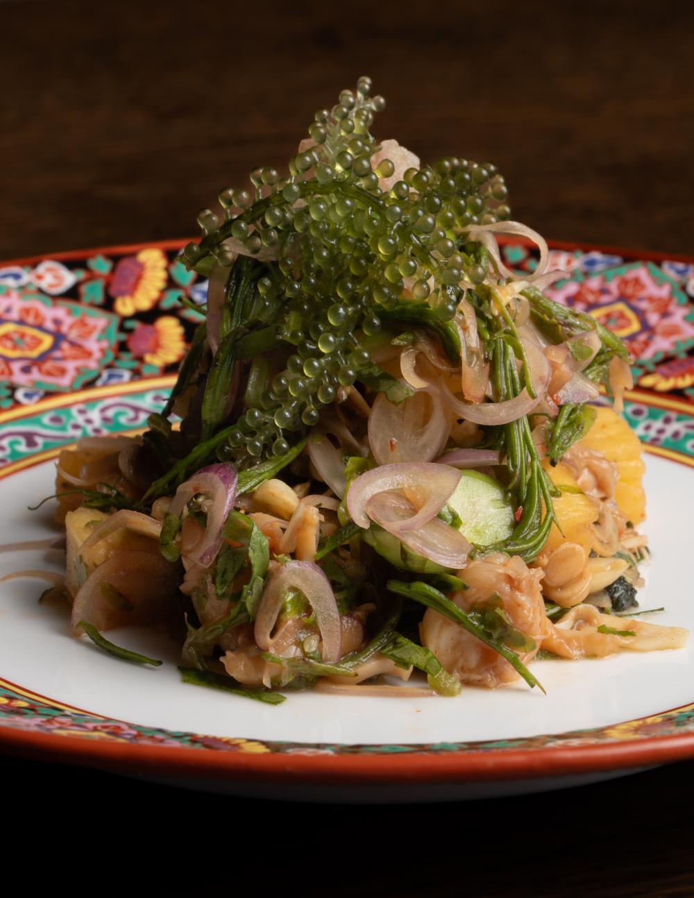 A dish of river prawns with herbs, pineapple and fermented fish sauce from Sai Buri, all local ingredients, served at AKKEE.