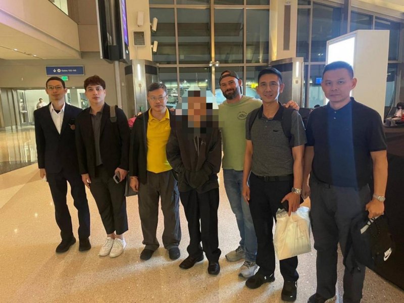 Former Buddhism office chief Nopparat Benjawatananun is taken into Thai custody on Saturday in the United States after being on the run. Royal Thai Police