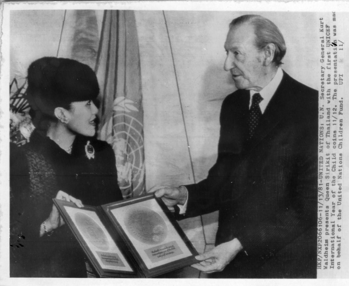 UN Secretary-General Kurt Waldheim presents Queen Sirikit with the first Unicef International Year of the Child coins in November 1981.