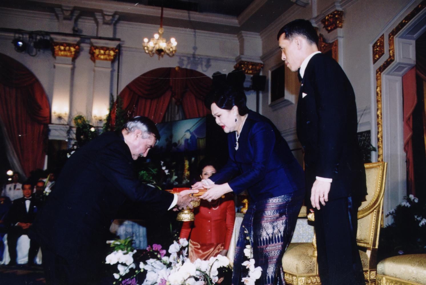Queen Sirikit was presented with the Louis Pasteur Award by the International Sericultural Commission for her contribution to the Thai silk industry in 2002, with then Crown Prince Maha Vajiralongkorn in attendance.