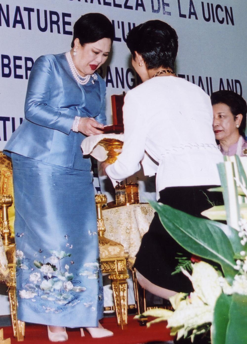 Queen Sirikit is presented with the IUCN Golden Award medallion for her efforts in protecting and reviving forests, wildlife and the environment at the opening ceremony of the IUCN World Conservation Congress in Bangkok in 2004.