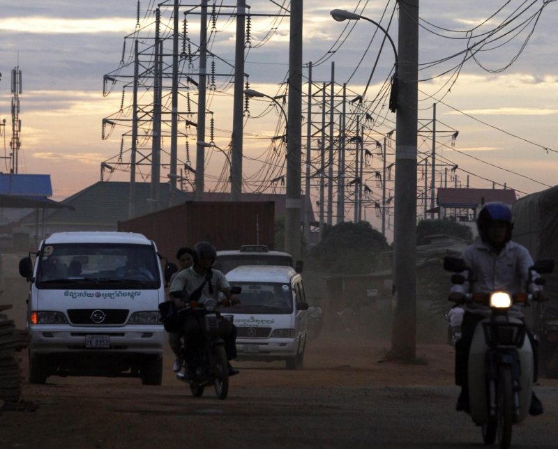 Utility poles are seen along a rural road in Cambodia. (Photo: Reuters)