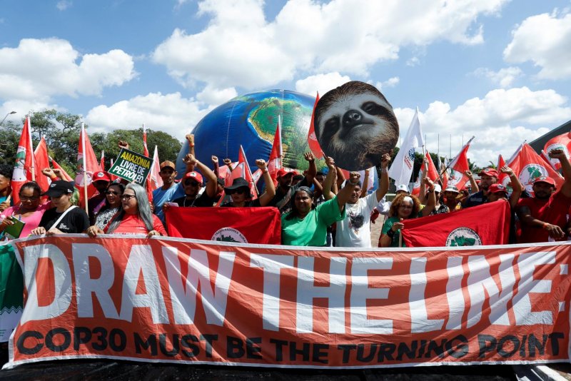 People rally for climate justice ahead of the COP30 climate summit in Brazil on July 23. (Photo: Reuters)