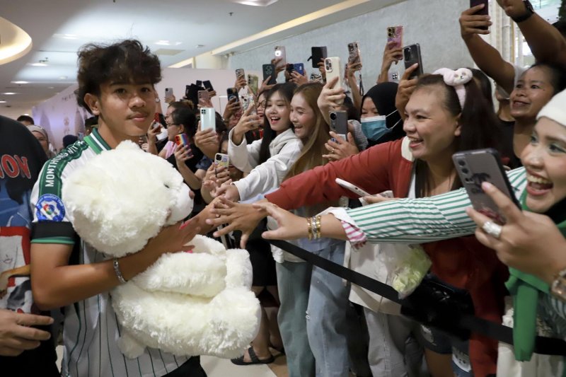 Worakorn 'Te' Changkhiandee, one of the standout players from the Mon Thong Wittaya School football team, is cheered on at a venue in Bangkok. The seven-player team from the school in Chachoengsao province became an internet sensation for beating the odds to win pivotal matches at the weekend. Somchai Poomlard