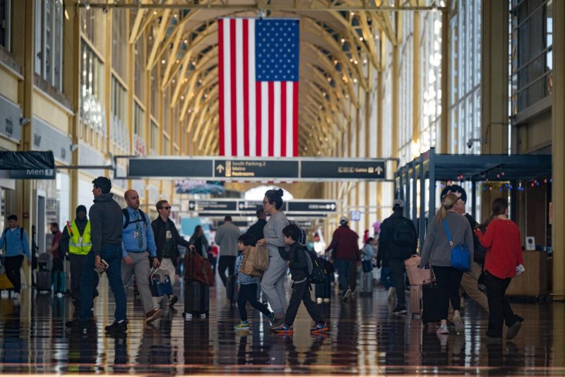People make their way through the terminal at Ronald Reagan Washington National Airport, more than a month into the ongoing US government shutdown. (Photo: Reuters)