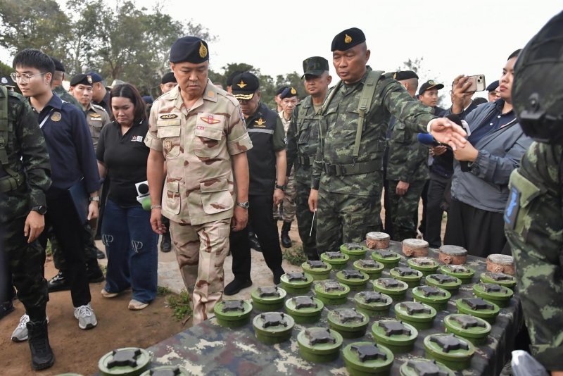 Prime Minister Anutin Charnvirakul inspects PMN-2 mines recovered from the field during a briefing on border security at the 11th Infantry Battalion headquarters at Phu Makua, Kantharalak district, Si Sa Ket, on Nov 11. GOVERNMENT HOUSE