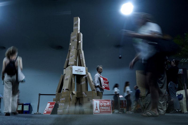 A cardboard Eiffel Tower highlights the fragility of the Paris Agreement at COP30, in Belem, Brazil. (Photo: Reuters)