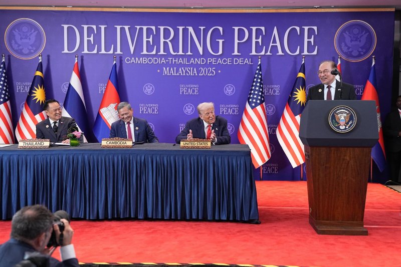 Malaysian Prime Minister Anwar Ibrahim speaks as US President Donald Trump watches during the signing of a ceasefire agreement between Thailand and Cambodia at the Asean Summit in Kuala Lumpur, Malaysia, on Oct 26. (Photo: New York Times)