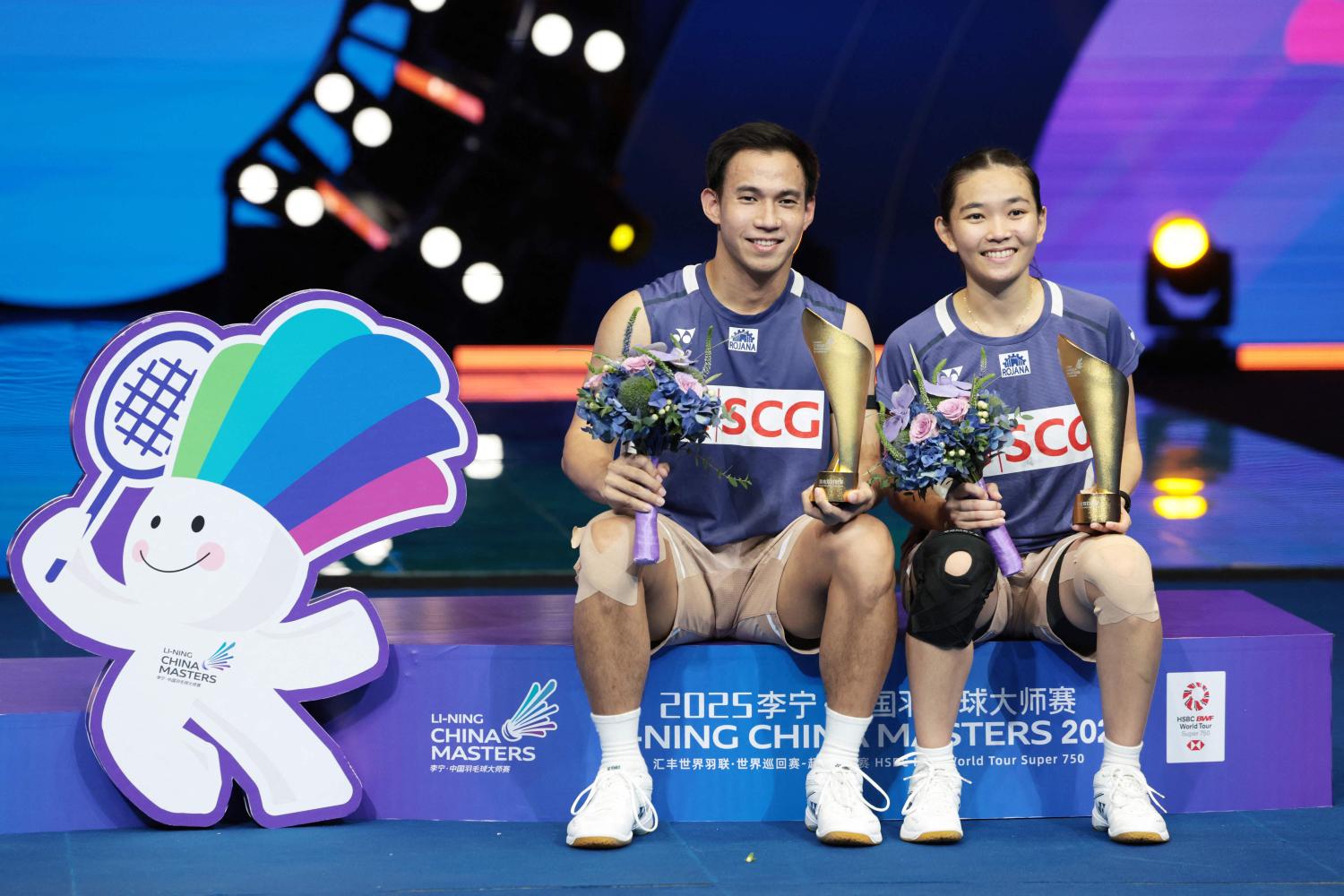 Mixed doubles players Dechapol Puavaranukroh and Supissara Paewsampran celebrate after winning the China Masters. AFP STR